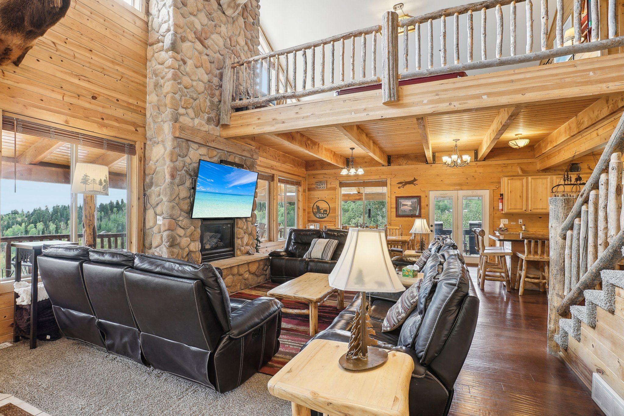 Two-story great room beneath exposed log beams
