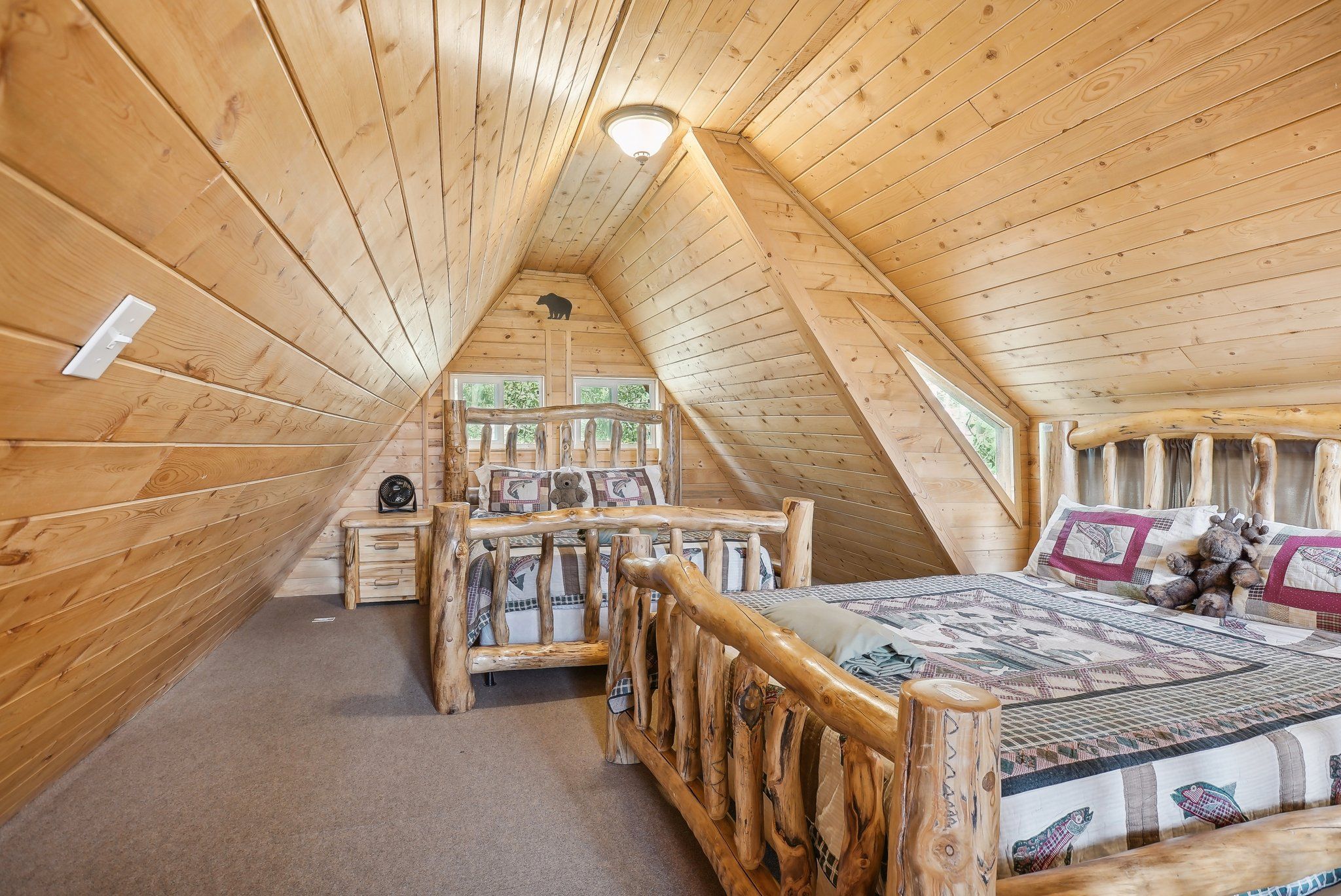 A-frame Bunkhouse loft with two queen beds