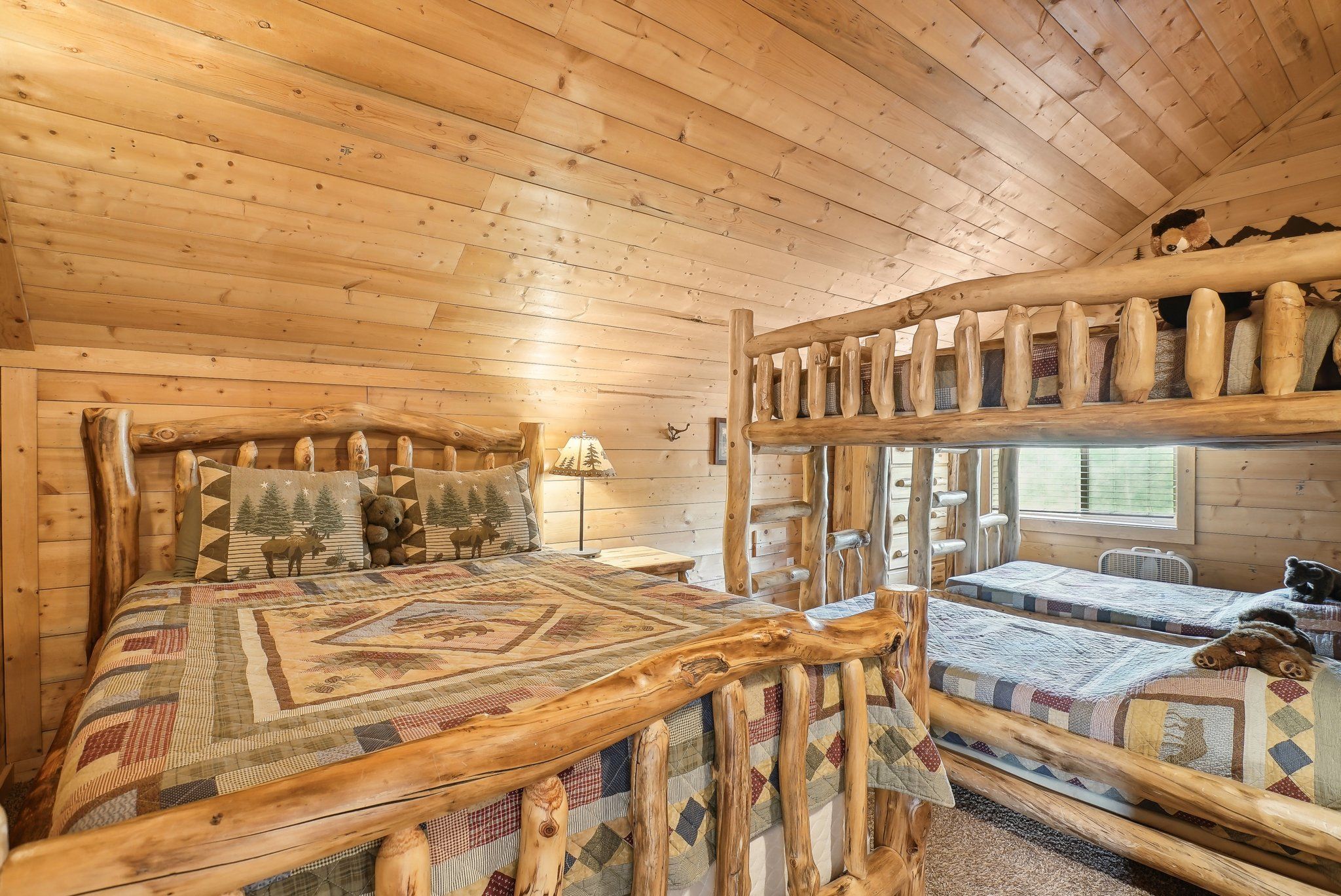 Elk Room with a queen bed and handmade twin bunks