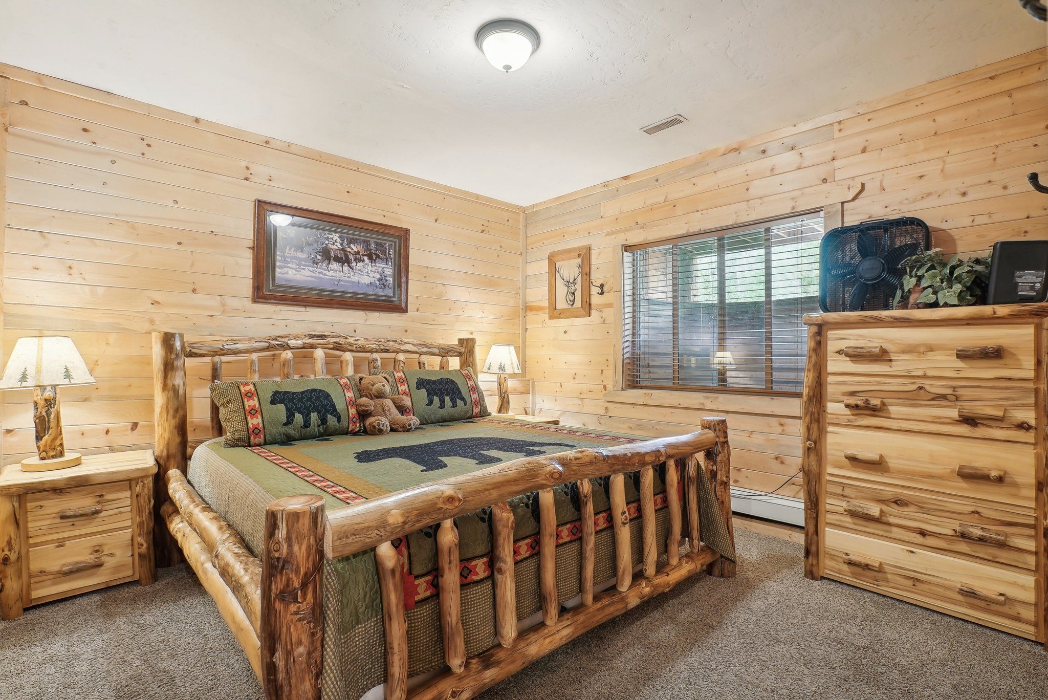 Deer Room with a king log bed on the lower level