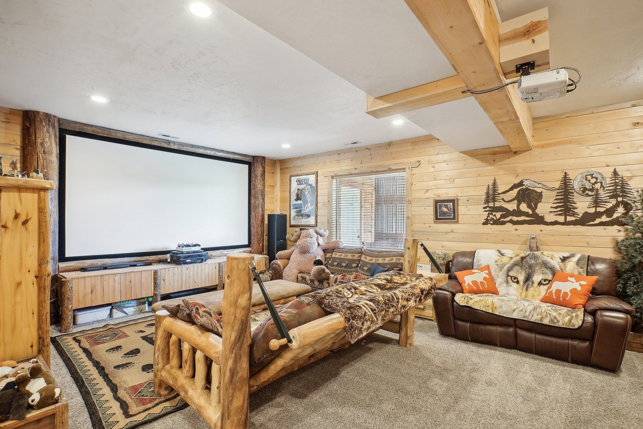 Theater room with a 12-foot projection screen and group seating