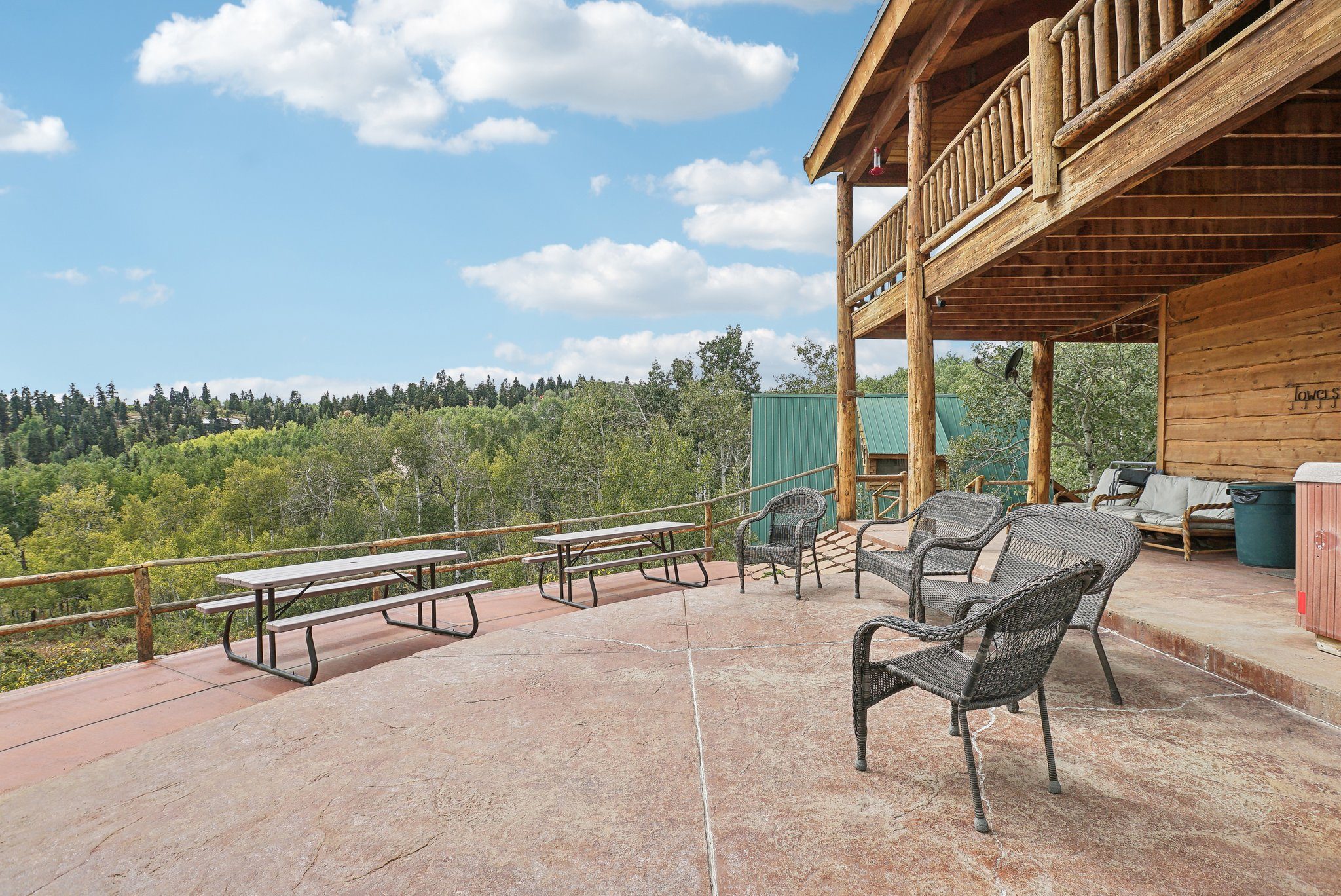 Lower lodge patio with picnic tables and mountain views