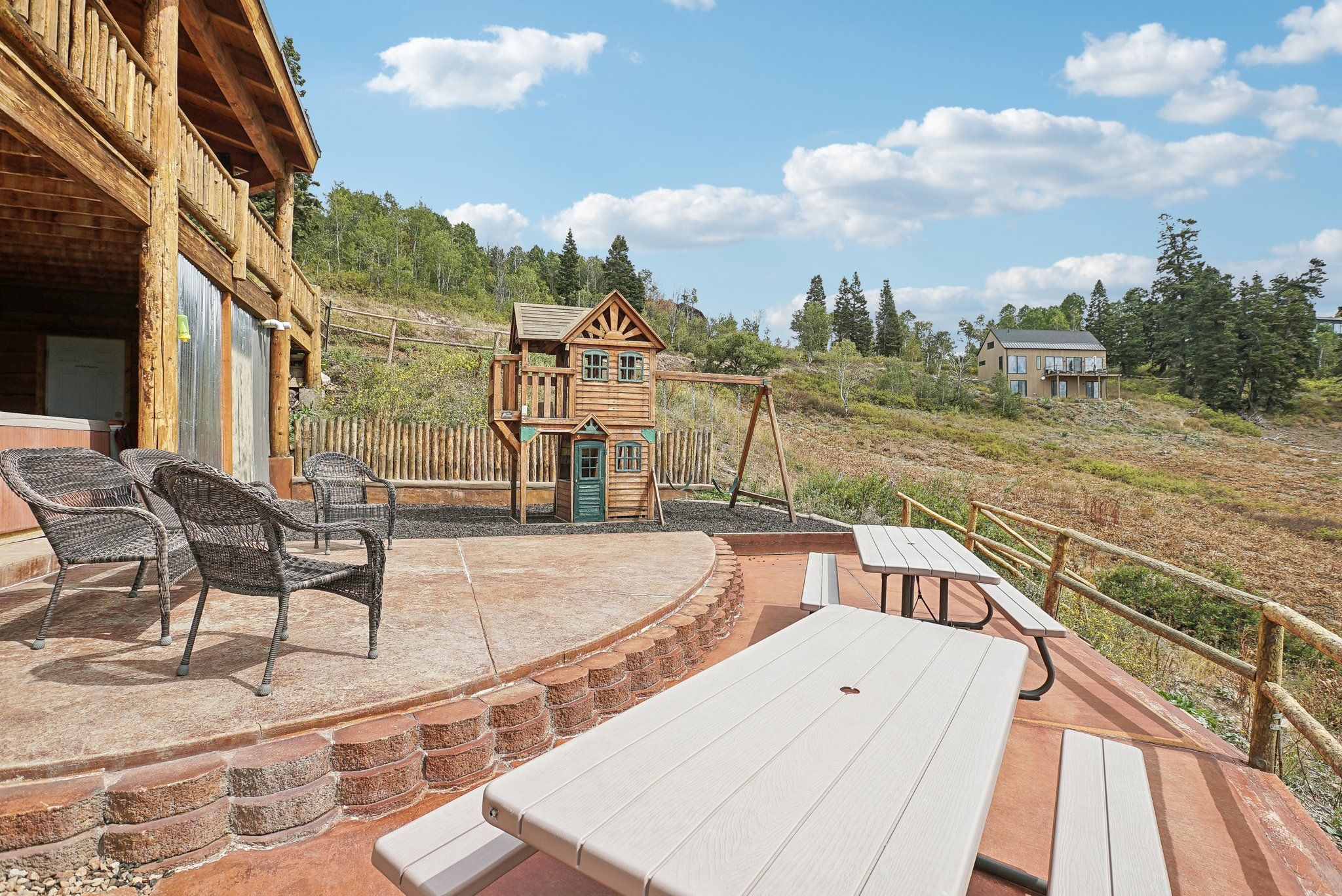 Playhouse and playground below the lodge deck